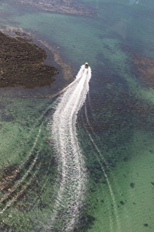 Motorboat Prints: Aerial shot of boat, Isles of Scilly, Cornwall, United Kingdom, Europe