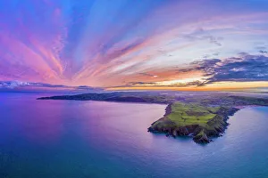 Meadow Prints: Aerial sunrise view over Baggy Point towards Woolacombe, Morte Bay, North Devon, England