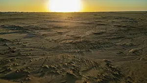 Vast Prints: Aerial of sunset over a beautiful sand dune in the Tibesti Mountains, Chad