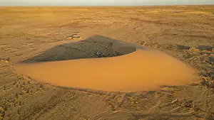 Vast Prints: Aerial of sunset over a beautiful sand dune in the Tibesti Mountains, Chad