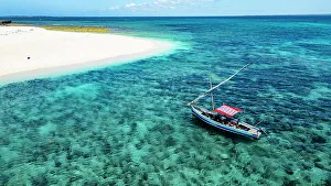 Zanzibar Prints: Aerial of a traditional Dhow on a white sand beach