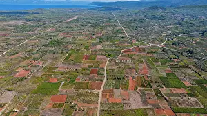 Time Prints: Aerial view of agricultural fields at Stari Grad plain in Croatia showcasing farming activities and landscape diversity