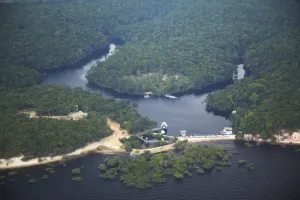 Manaus Prints: Aerial view of Amazon rainforest and beach resort along the Rio Negro