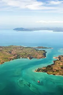 Waterscape Prints: Aerial view over Ambato cape, Nosy Faly island and Nosy Be background