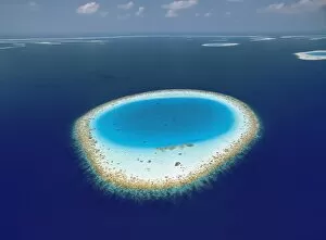Aerial view of atolls and coral reefs in the Maldives, Indian Ocean