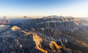 Fassa Valley Prints: Aerial view of autumn sunset on rocky peaks of Sella Group, Val Gardena, Val di Fassa