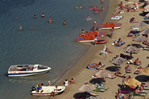 Crowded Prints: Aerial view over boats and people on a crowded beach