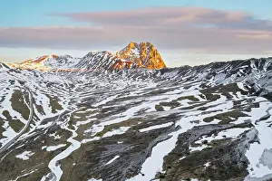 Plateau Prints: Aerial view of Campo Imperatore plateau during spring thaw at dawn