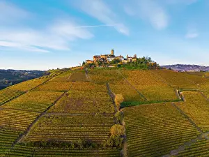 Autumnal Prints: Aerial view of Castiglione Falletto on a beautiful autumn day