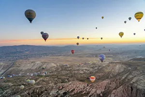 Outdoor Activity Prints: Aerial view of Cavusin and hot air balloons at dawn