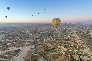 Ancient History Prints: Aerial view of Cavusin and hot air balloons at dawn