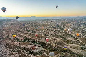 Romance Prints: Aerial view of Cavusin and hot air balloons at dawn