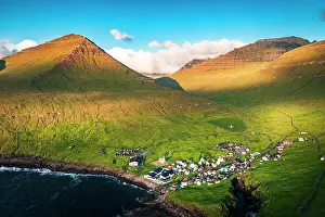 Gjogv Prints: Aerial view of the coastal village of Gjogv and mountains at sunrise