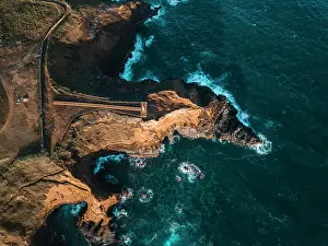 Aerial view of the coasts and cliffs of the island of Sao Miguel over the lighthouse of Farolim dos Fenais da Ajuda, Azores Islands, Portugal, Atlantic, Europe