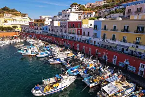 Fishing Village Prints: Aerial view of the colorful Italian village of Ponza with fishing vessels in the foreground