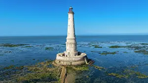 Safety Prints: Aerial view of Cordouan lighthouse surrounded by calm waters and rocks in France