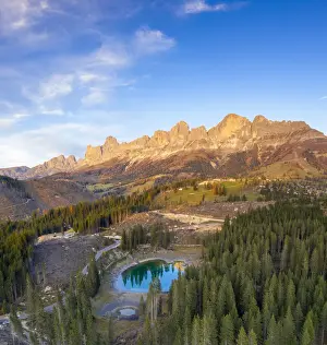 Aerial view of deforestation surrounding Carezza Lake after the violent Vaia storm