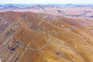 Freeways Prints: Aerial view of empty desert road, Mirador del Risco de las Penas viewpoint, Pajara