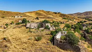 Homes Prints: Aerial view of destroyed buildings in Jabrayil village showing signs of conflict in Qarabaqh region of Azerbaijan