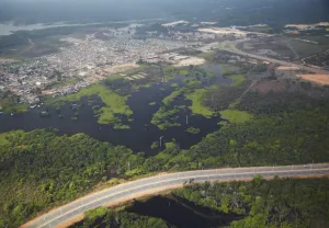 Manaus Prints: Aerial view of development encroaching on the Amazon rainforest and Rio Negro