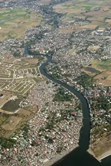 Manila Prints: Aerial view of dormitory township on river into south end of Manila Bay