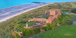 11th Century Prints: Aerial view by drone of Bamburgh Castle