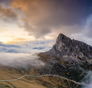 Belluno Prints: Aerial view by drone of foggy sky at sunset over Ra Gusela and Giau Pass in autumn