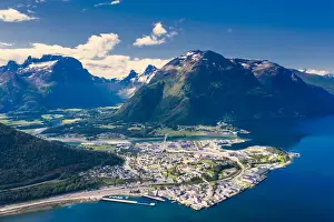Aerial view by drone of mountains and fjord surrounding Andalsnes town, Rauma municipality