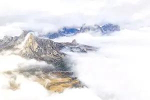 Belluno Prints: Aerial view by drone of Ra Gusela and Cinque Torri mountains covered by clouds