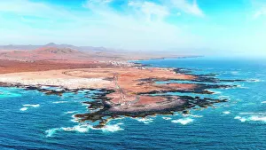 Canary Prints: Aerial view of El Toston Lighthouse on volcanic coastline