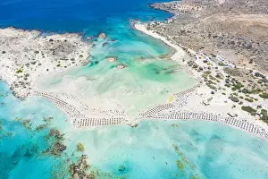 Aerial view of the equipped Elafonissi beach set in the unspoiled turquoise lagoon, Crete island, Greek Islands, Greece, Europe