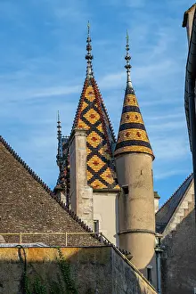 Towers Prints: Aerial view highlights the rich architecture of Hospices de Beaune showing the distinctive roofs in Burgundy
