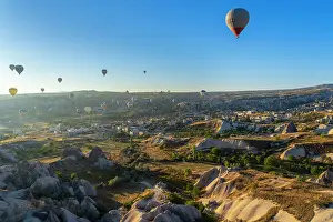 Outdoor Activity Prints: Aerial view of hot air balloons over rock formations at sunrise