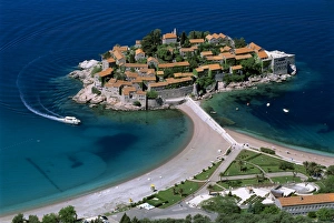 Aerial view over the island and beaches, Sveti Stefan, The Budva Riviera, Montenegro, Europe