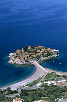 Aerial view over island and sandbar, Sveti Stefan, The Budva Riviera, Montenegro, Europe