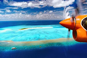 Tropical Climate Prints: Aerial view of island and seaplane, Male Atoll, The Maldives, Indian Ocean, Asia
