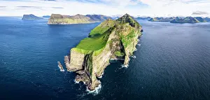 Lighthouses Prints: Aerial view of Kallur lighthouse on majestic cliffs washed by the blue Atlantic ocean