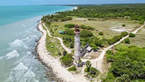 Guard Prints: Aerial view of Kovalim lighthouse surrounded by coastline and greenery in Jaffna district