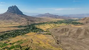 Geological Prints: Aerial view of large rock formation near historical site in Azerbaijan captures vast landscape and rural life