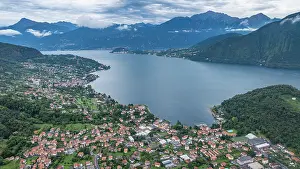 Homes Prints: Aerial view of Lenno showing the lake, mountains, and buildings in Italy near the water