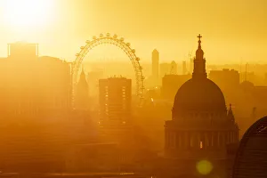 Aerial view of London skyline at sunset, including London Eye and St. Pauls Cathedral, London, England, United Kingdom, Europe