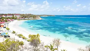 Antigua Prints: Aerial view of luxury resort on white sand beach washed by the turquoise Caribbean Sea