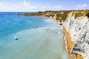 Aerial view of majestic limestone cliffs framing the golden sand of Xi beach, Kefalonia, Ionian Islands, Greek Islands, Greece, Europe