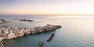 Aerial view of old town and lighthouse of Vieste at dawn, Foggia province