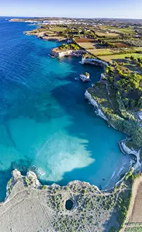 Salento Prints: Aerial view of the open grotto known as Grotta Sfondata on cliffs along the coastline