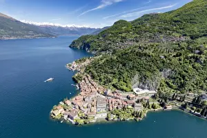 Varenna Prints: Aerial view of the picturesque village of Varenna surrounded by Lake Como and gardens