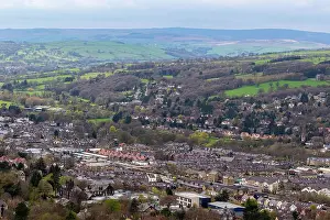 Discover Prints: Aerial view of a quaint town nestled in a lush valley with rolling hills in the background in Ilkley