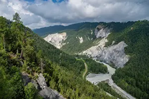 Flowing Prints: Aerial view of the Rhein gorge showcasing the river flowing through green forests and rocky cliffs in Switzerland