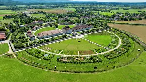 Parks Prints: Aerial view of the Royal Saltworks showcasing gardens and buildings in a green landscape of France