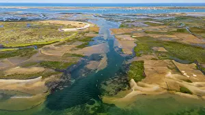 Watercraft Prints: Aerial view of sandy wetlands showing waterways and patches of vegetation in Algarve region of Portugal